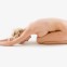 Nude woman in yoga position